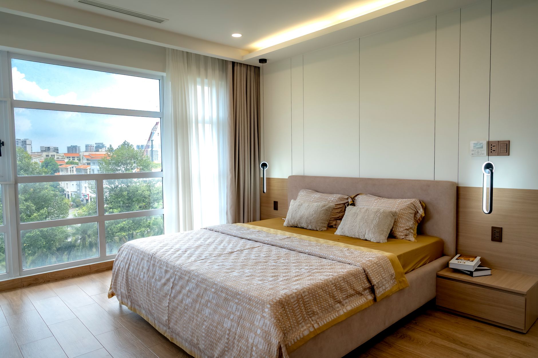 A Nectar Classic memory foam mattress on a simple bed frame in a bright bedroom, side view showing the layered foam construction